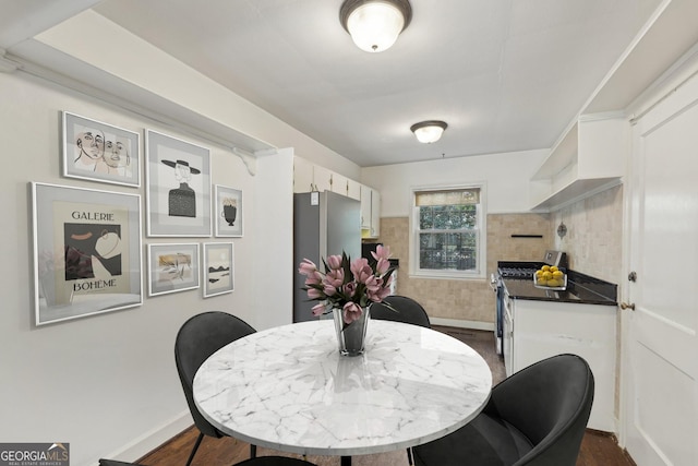55 Delmont Dr NE Unit D1, Atlanta, GA 30305 - dining area with dark wood-style floors