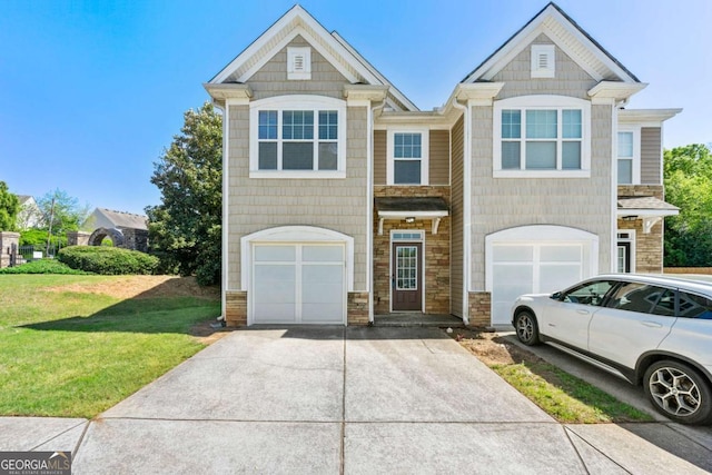 2060 Executive Dr, Duluth, GA 30096 - multi unit property with stone siding, an attached garage, a front yard, and concrete driveway