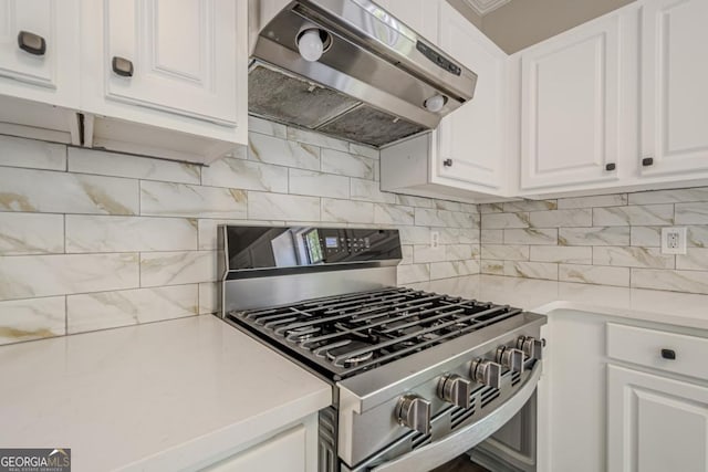 1331 Windage Ct SW, Marietta, GA 30008 - kitchen featuring stainless steel gas range, ventilation hood, white cabinetry, light countertops, and tasteful backsplash