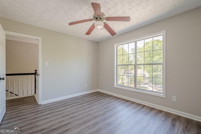 1331 Windage Ct SW, Marietta, GA 30008 - empty room featuring wood finished floors, a textured ceiling, and a ceiling fan
