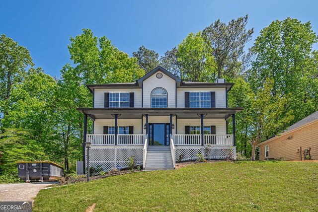 1331 Windage Ct SW, Marietta, GA 30008 - view of front of home with a porch, a front lawn, and a chimney