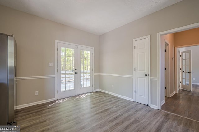 1331 Windage Ct SW, Marietta, GA 30008 - unfurnished dining area featuring french doors and wood finished floors