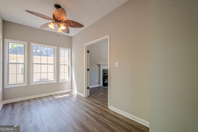 1331 Windage Ct SW, Marietta, GA 30008 - empty room with a ceiling fan and dark wood-style floors