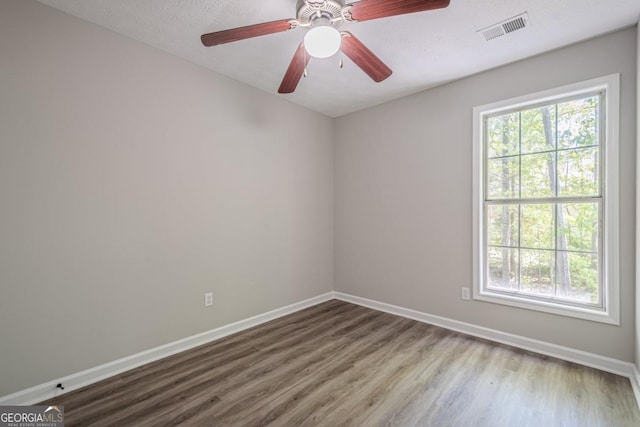 1331 Windage Ct SW, Marietta, GA 30008 - empty room with wood finished floors and a ceiling fan