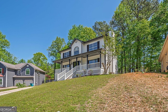 1331 Windage Ct SW, Marietta, GA 30008 - view of front of house with a porch, a front yard, a garage, and stairs