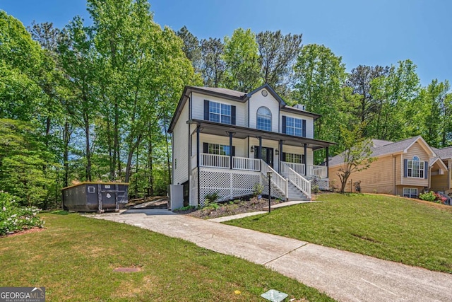 1331 Windage Ct SW, Marietta, GA 30008 - view of front facade with a porch, a front lawn, and driveway