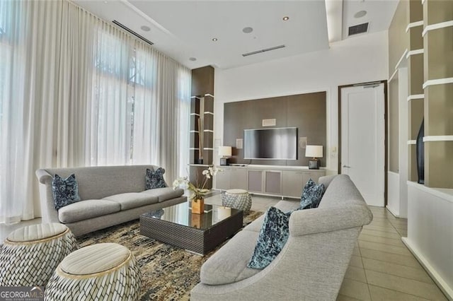 living room with visible vents and tile patterned floors