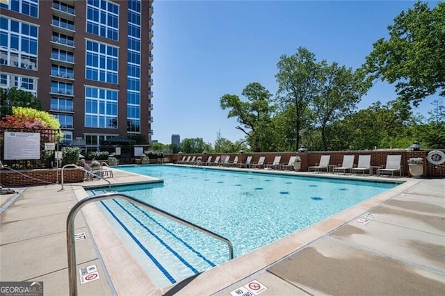 community pool featuring a patio area