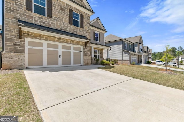 craftsman-style house featuring concrete driveway, an attached garage, a residential view, and stone siding