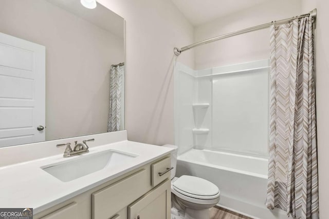 bathroom with shower / bath combination with curtain, vanity, and toilet