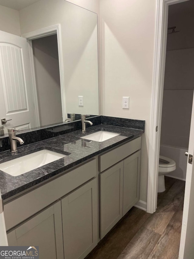 124 Shenandoah Ln, Lagrange, GA 30241 - full bathroom with wood finished floors, a sink, double vanity, and toilet
