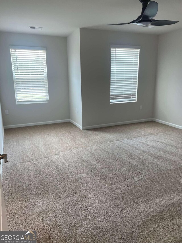 124 Shenandoah Ln, Lagrange, GA 30241 - unfurnished room featuring visible vents, carpet flooring, baseboards, and ceiling fan