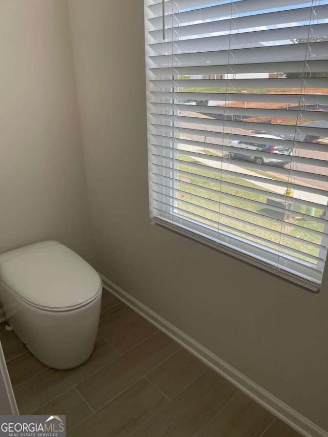 124 Shenandoah Ln, Lagrange, GA 30241 - bathroom with baseboards, wood finish floors, and toilet