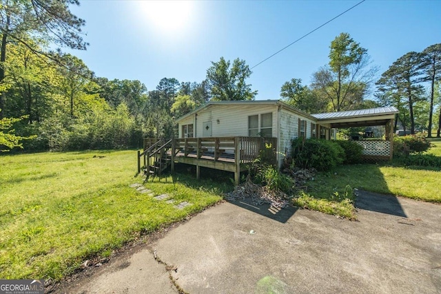 exterior space featuring a yard and a deck