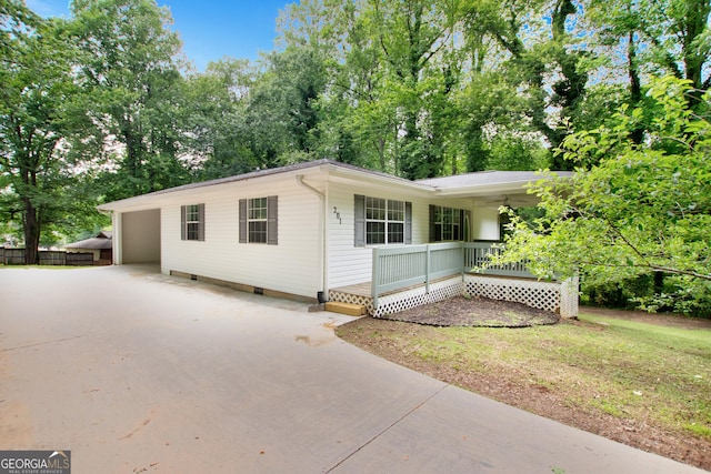 201 Oakdale Dr, Cornelia, GA 30531 - view of front of house with a porch, driveway, crawl space, and view of scattered trees