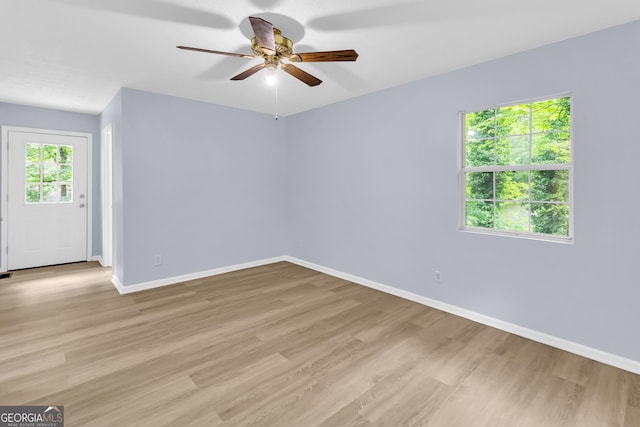 201 Oakdale Dr, Cornelia, GA 30531 - spare room with baseboards, a ceiling fan, and light wood-style flooring