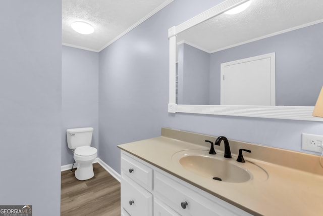 201 Oakdale Dr, Cornelia, GA 30531 - half bath with a textured ceiling, wood finished floors, toilet, vanity, and crown molding