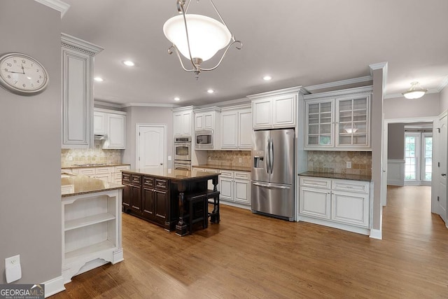 kitchen with crown molding, open shelves, appliances with stainless steel finishes, and tasteful backsplash