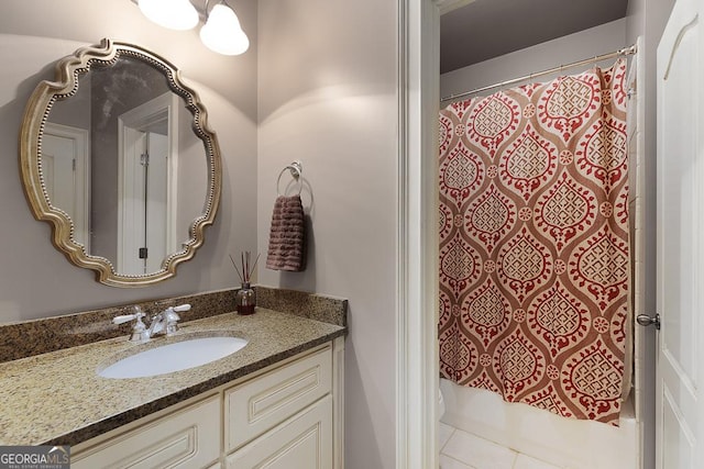 bathroom with vanity, tile patterned flooring, and shower / bath combo with shower curtain