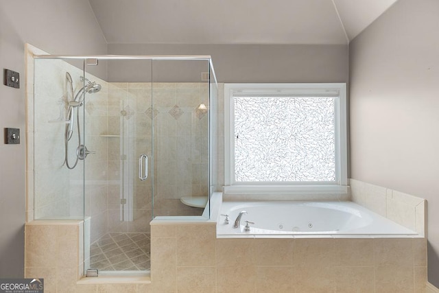 bathroom with a whirlpool tub and a stall shower