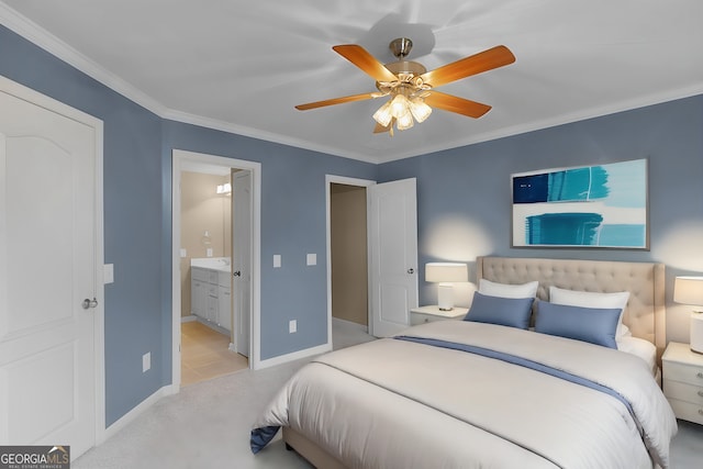 bedroom with a ceiling fan, baseboards, ornamental molding, carpet flooring, and ensuite bath