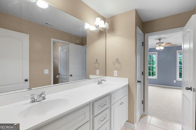 full bathroom featuring a sink, tile patterned floors, double vanity, and visible vents