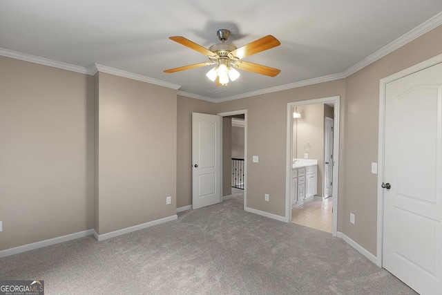 unfurnished bedroom featuring crown molding, baseboards, ceiling fan, and light carpet