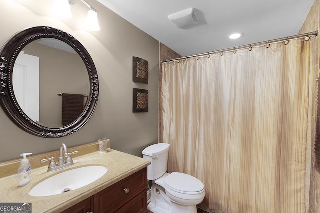 full bathroom featuring vanity and toilet
