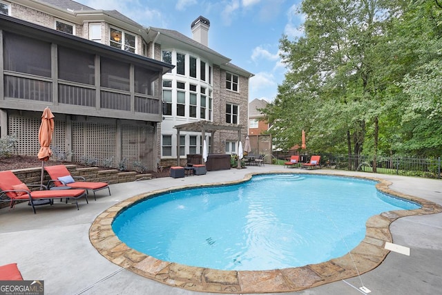 view of pool with fence, a pergola, a sunroom, a fenced in pool, and a patio