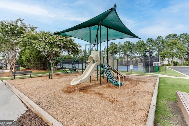 communal playground featuring fence