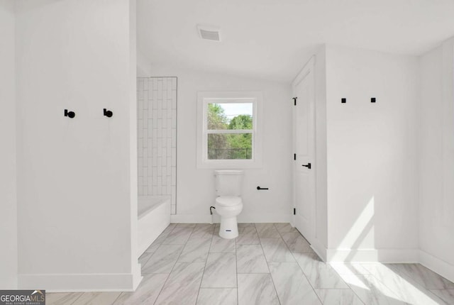 full bathroom featuring lofted ceiling, visible vents, marble finish floor, and toilet