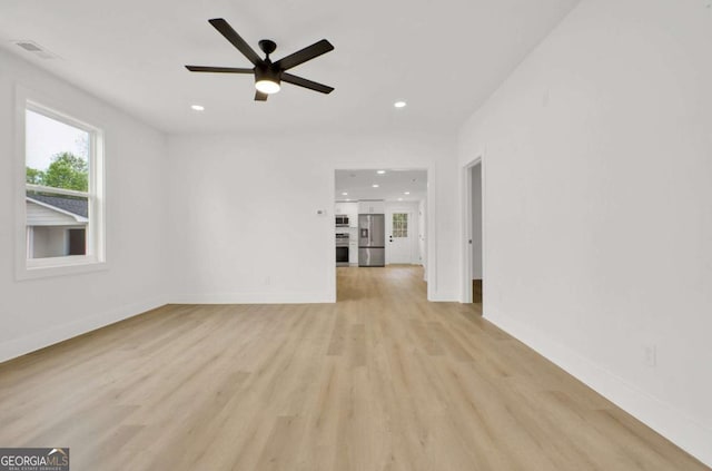 unfurnished living room with recessed lighting, light wood finished floors, visible vents, baseboards, and ceiling fan