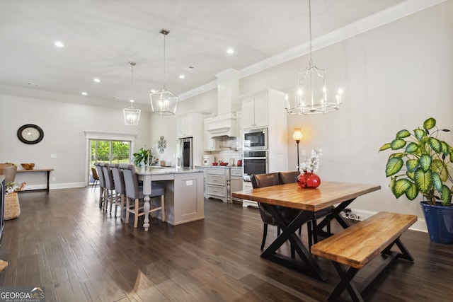 906 Abingdon Cv, Bonaire, GA 31005 - dining room featuring recessed lighting, a chandelier, ornamental molding, and dark wood-type flooring