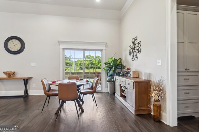 906 Abingdon Cv, Bonaire, GA 31005 - dining area featuring dark wood-type flooring and baseboards