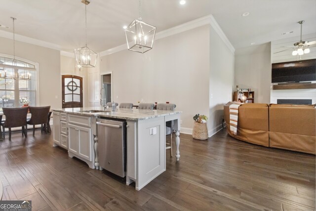 906 Abingdon Cv, Bonaire, GA 31005 - kitchen with stainless steel dishwasher, a chandelier, a kitchen bar, ornamental molding, and white cabinetry