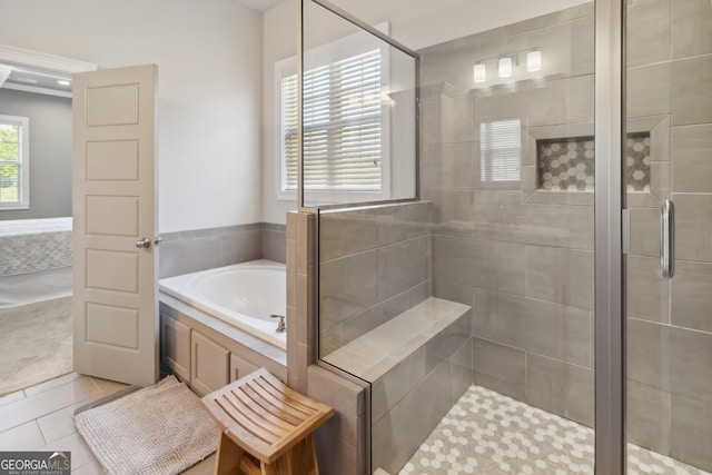 906 Abingdon Cv, Bonaire, GA 31005 - full bath featuring a bath, a shower stall, and tile patterned floors