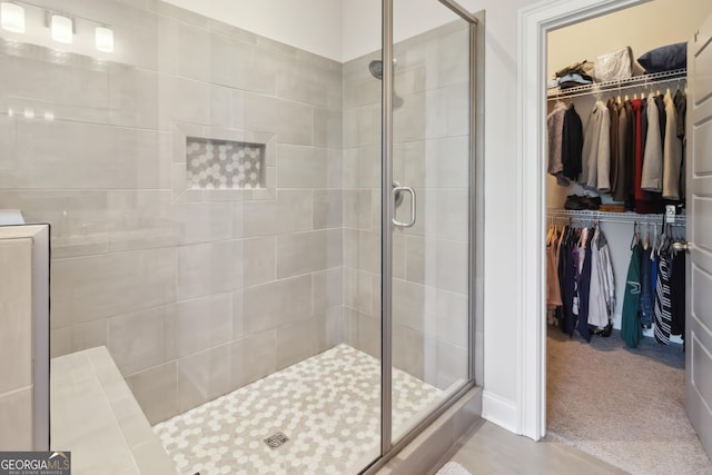 906 Abingdon Cv, Bonaire, GA 31005 - bathroom featuring a shower stall and a walk in closet