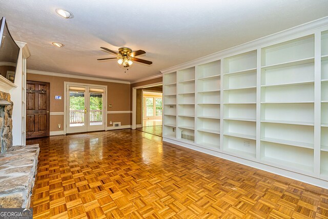 unfurnished living room with baseboards, a ceiling fan, a stone fireplace, ornamental molding, and recessed lighting