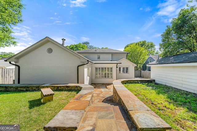 rear view of property featuring a patio area