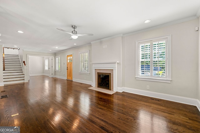 unfurnished living room with plenty of natural light, a ceiling fan, baseboards, recessed lighting, and crown molding
