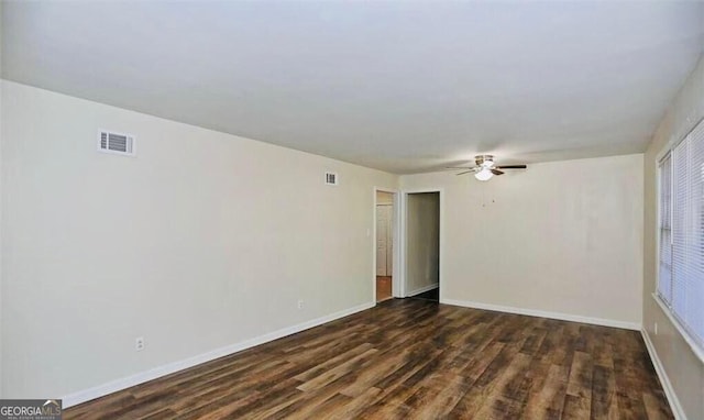 8524 Vining Way, Savannah, GA 31406 - spare room featuring dark wood-style flooring, ceiling fan, and baseboards
