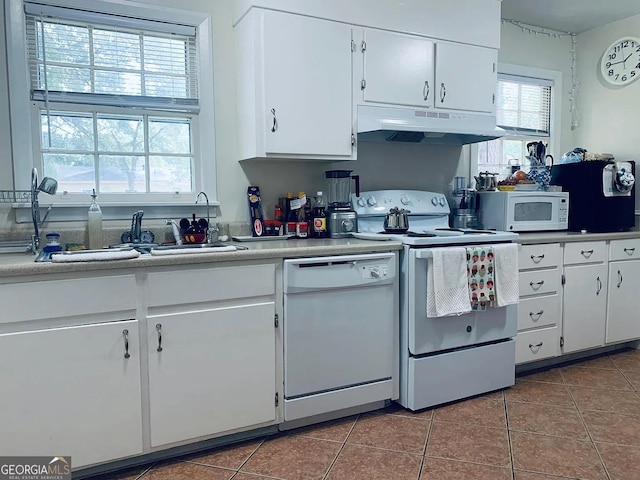 8524 Vining Way, Savannah, GA 31406 - kitchen featuring under cabinet range hood, white appliances, tile patterned floors, and white cabinetry
