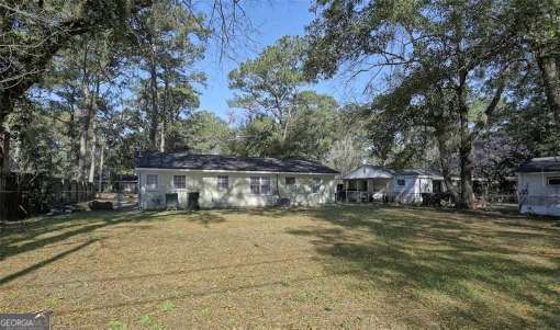 8524 Vining Way, Savannah, GA 31406 - rear view of property featuring a yard