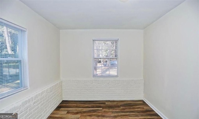8524 Vining Way, Savannah, GA 31406 - empty room with dark wood-type flooring and a wainscoted wall