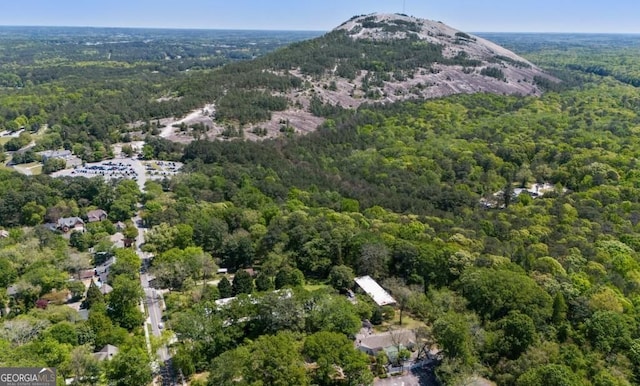 305 Stonecliff Ct, Stone Mountain, GA 30083 - aerial view of property and surrounding area with a heavily wooded area and a mountainous background