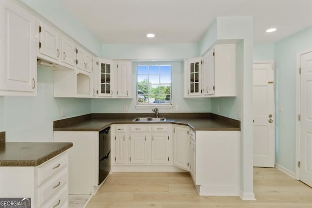 305 Stonecliff Ct, Stone Mountain, GA 30083 - kitchen featuring dark countertops, light wood finished floors, glass insert cabinets, white cabinetry, and recessed lighting