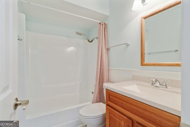 305 Stonecliff Ct, Stone Mountain, GA 30083 - bathroom featuring vanity, shower / tub combo, and a wainscoted wall