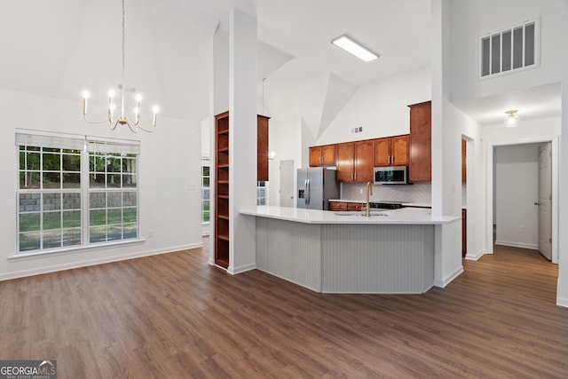 103 St Albans Way, Peachtree City, GA 30269 - kitchen featuring a sink, high vaulted ceiling, a chandelier, stainless steel appliances, and visible vents