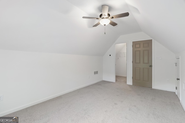 103 St Albans Way, Peachtree City, GA 30269 - additional living space featuring ceiling fan, light colored carpet, baseboards, lofted ceiling, and visible vents