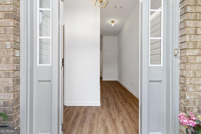 103 St Albans Way, Peachtree City, GA 30269 - hall with baseboards, wood finished floors, and visible vents